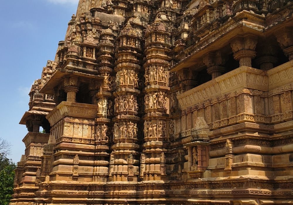 A temple tower covered from base to spire in carved figures