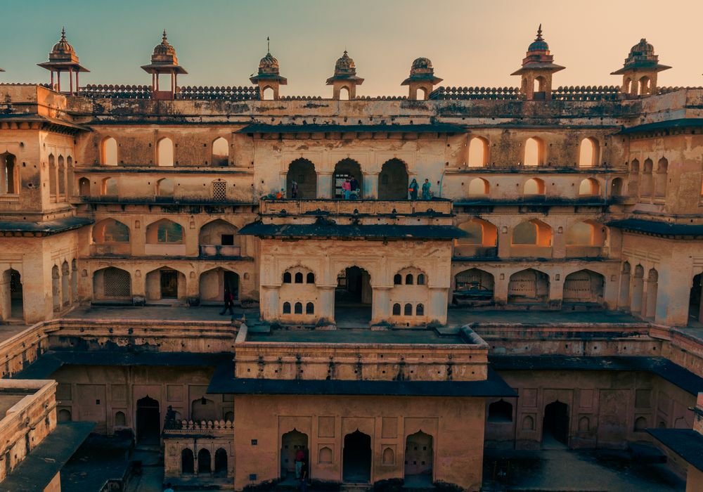 A sandstone palace facade with arched balconies