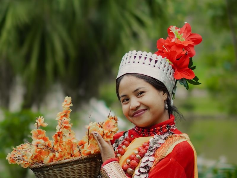 A flower seller in traditional Sikkimese dress