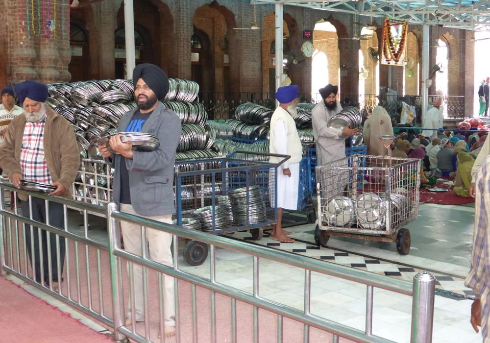 Volunteers serving food at a community kitchen