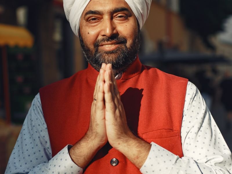 A Sikh man greeting with folded hands