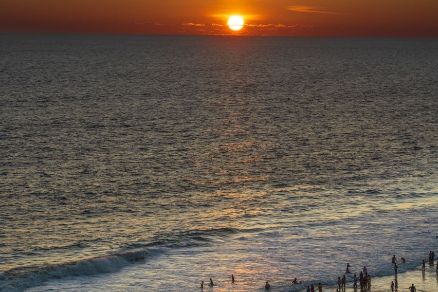 The sun setting over the sea