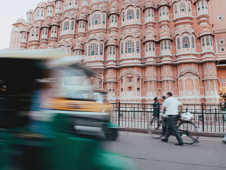 The Hawa Mahal in Jaipur with an auto-rickshaw passing