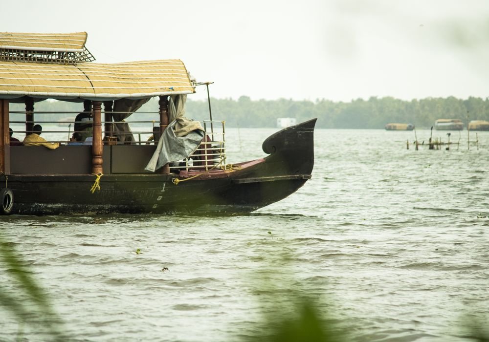 The prow of a houseboat on open water