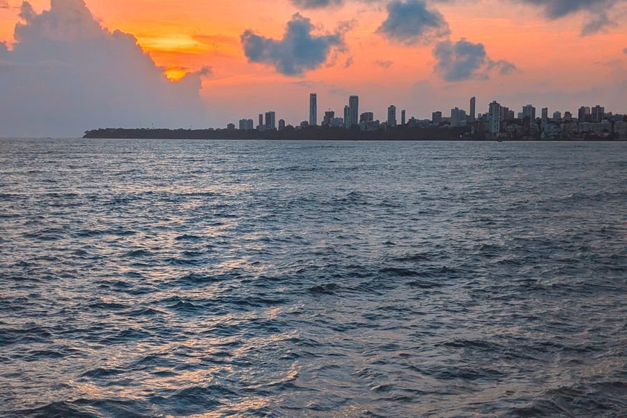 The city skyline at sunset seen across the water