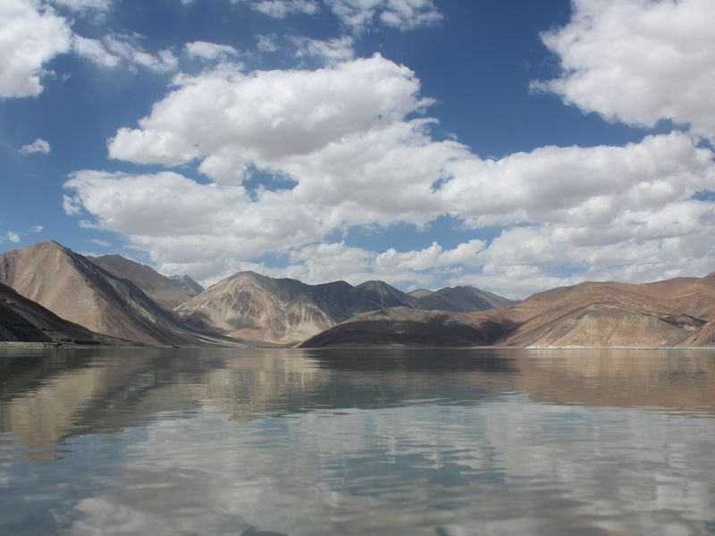 A high-altitude lake between bare mountains in Ladakh