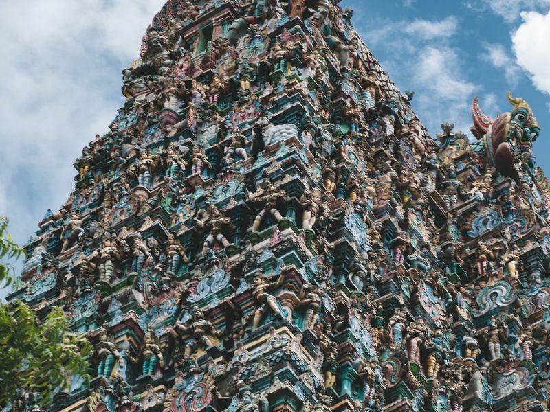 A carved gopuram tower on a South Indian temple