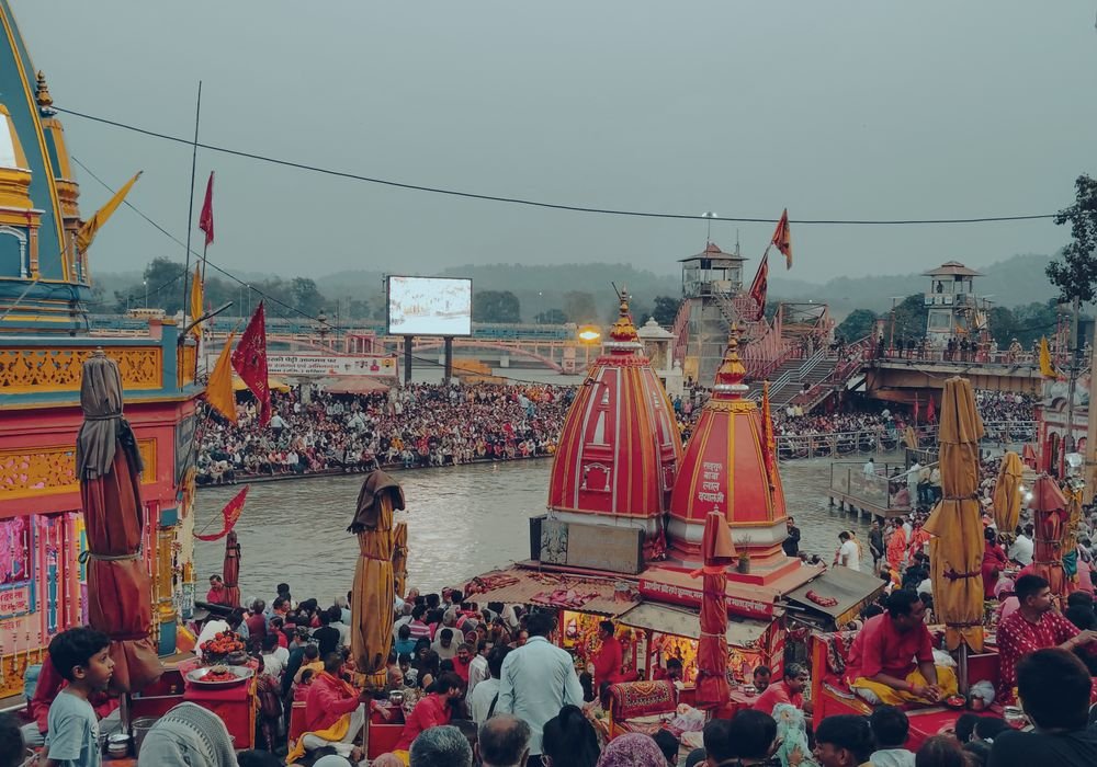 A crowd gathered on the river ghats for an evening ceremony