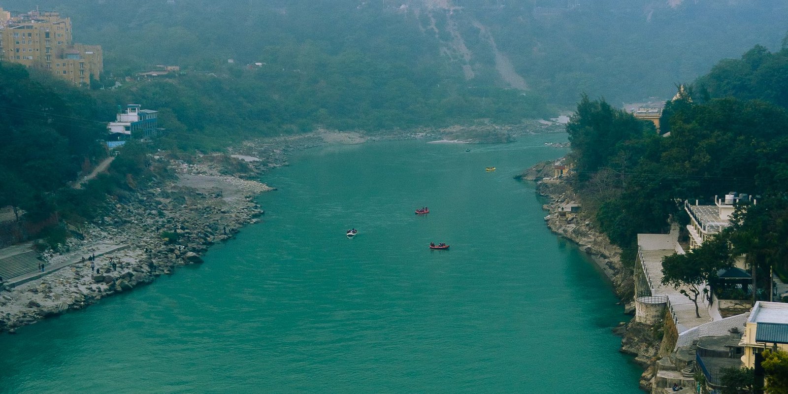 The Ganges running green through forested hills